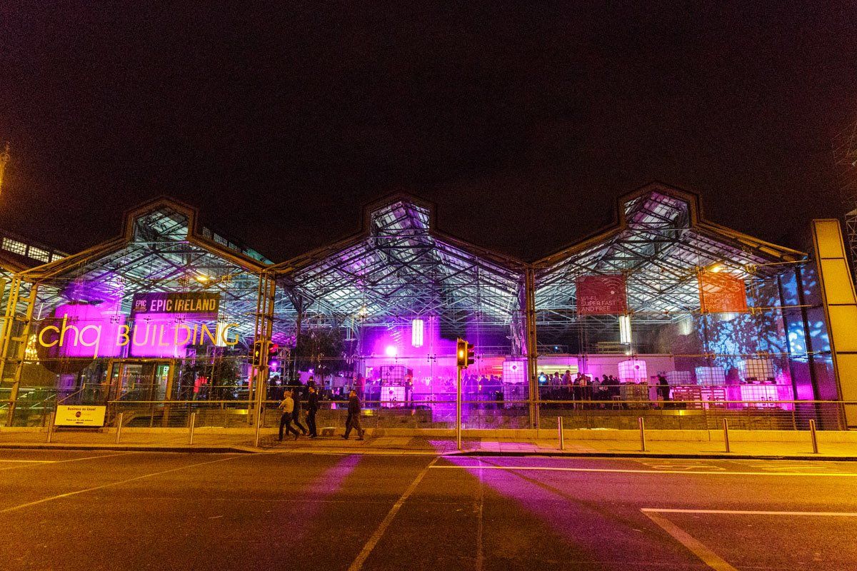 The chq Building lit up at night on Custom House Quay